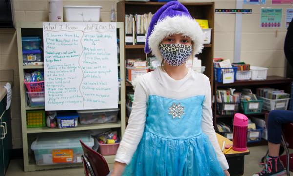 Girl is dressed as a book character